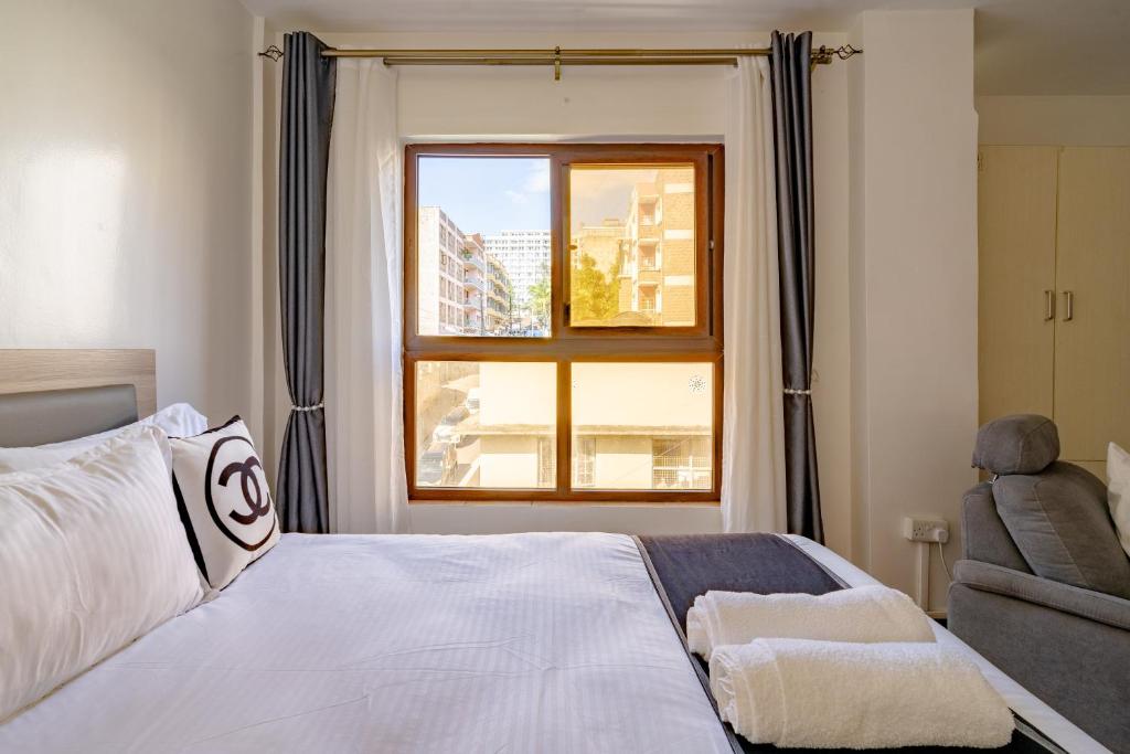 Ένα ή περισσότερα κρεβάτια σε δωμάτιο στο Emeli Hotel Luxury Suite