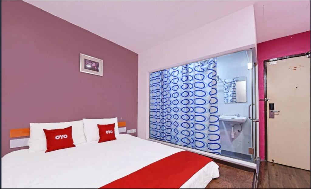 Ένα ή περισσότερα κρεβάτια σε δωμάτιο στο Hotel O Orange Hotel Kuala Pilah