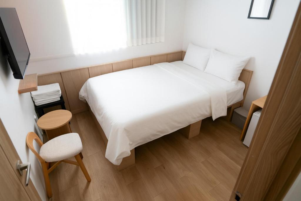 Ένα ή περισσότερα κρεβάτια σε δωμάτιο στο stay105행궁