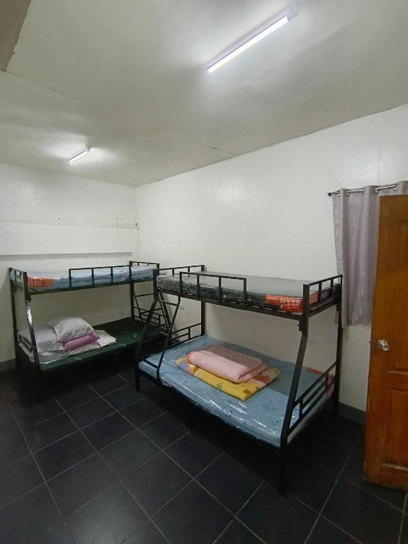 Ένα ή περισσότερα κρεβάτια σε δωμάτιο στο Renz transient house