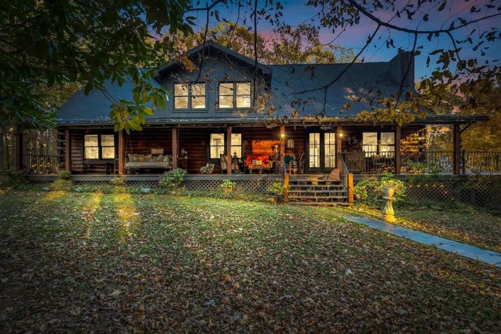 a large house with a yard in front of it at Secluded Lakeview Retreat 10 Mins to Leipers Fork in Kingfield