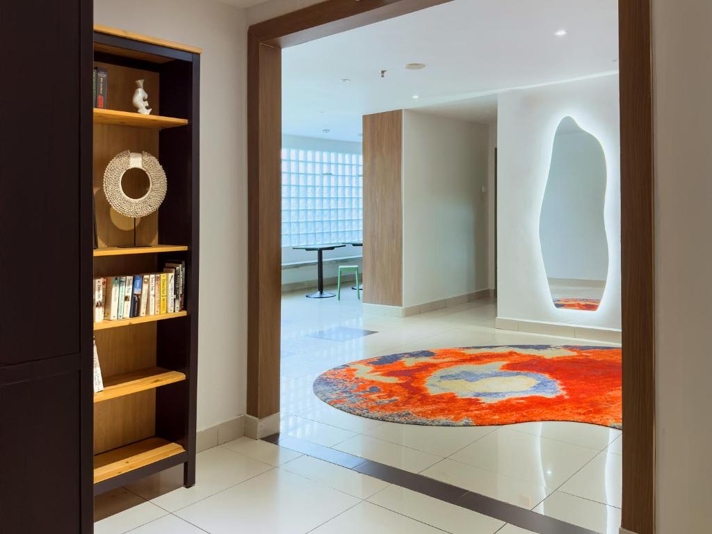 a living room with a rug on the floor at Living At DSulaiman Hotel in Kuala Lumpur