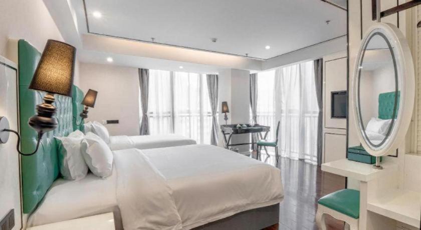 Ένα ή περισσότερα κρεβάτια σε δωμάτιο στο Xana Lite Anqing Yuexi Swan Squre Branch