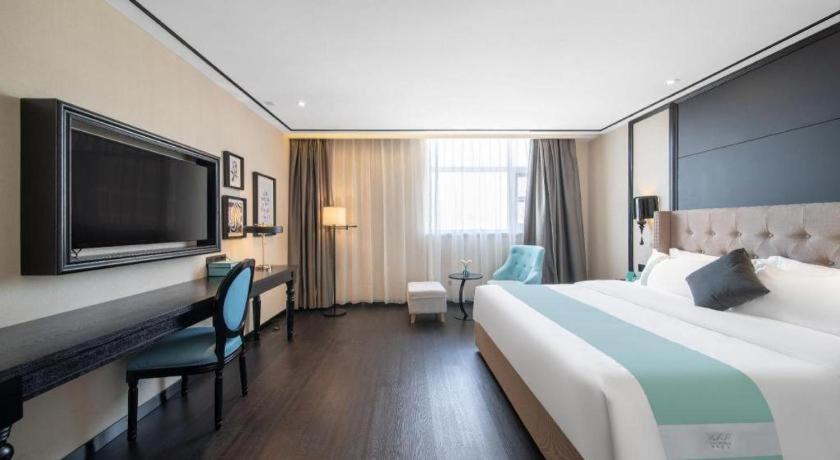 TV a/nebo společenská místnost v ubytování Xana Hotelle Jinan Daminghu North Gate