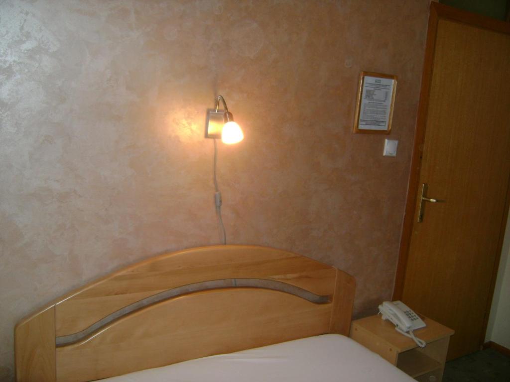 Postel nebo postele na pokoji v ubytování Konak Vukasinovic