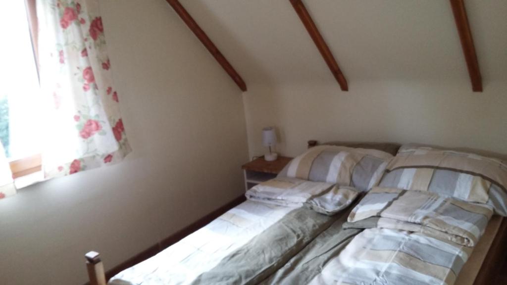 Postel nebo postele na pokoji v ubytování Zagroda Pod Gontem