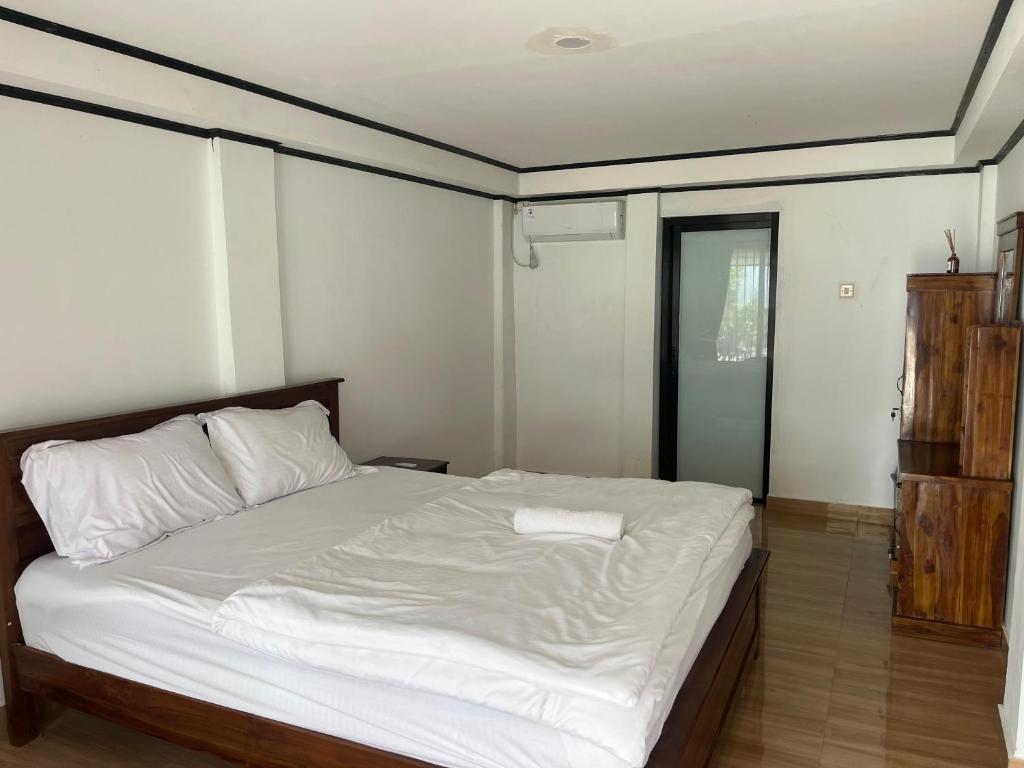 Postel nebo postele na pokoji v ubytování Kurniawan homestay 2