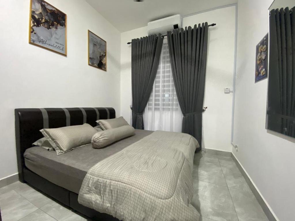 Postel nebo postele na pokoji v ubytování D'Savanna Homestay Gerik