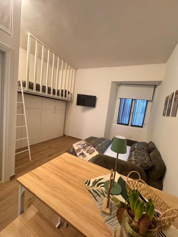 a living room with a couch and a table at Villatico 25 in Chiari