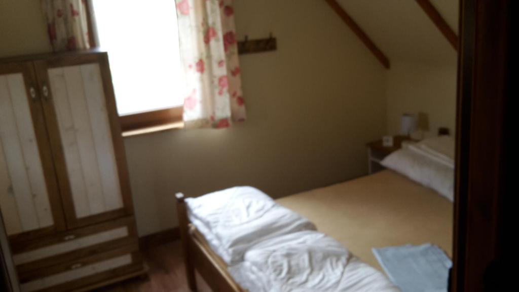 Postel nebo postele na pokoji v ubytování Zagroda Pod Gontem