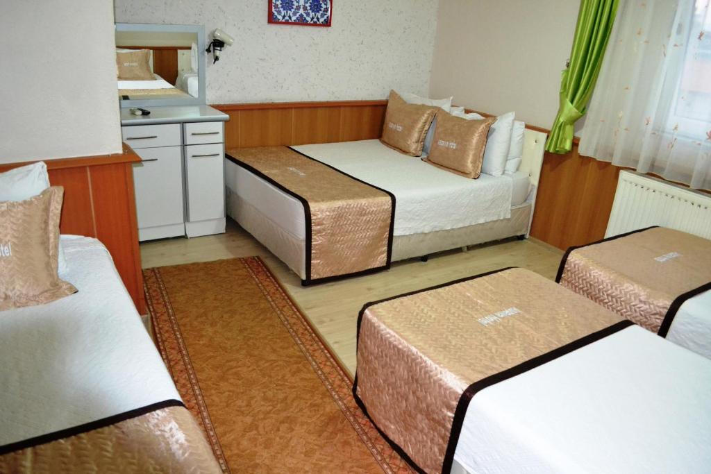 Giường trong phòng chung tại Aspawa Hotel