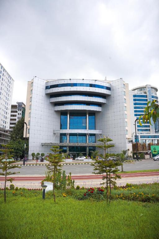 a building with a park in front of it at Inter Luxury Hotel in Addis Ababa