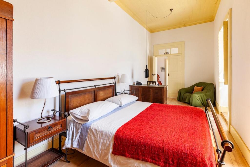 Giường trong phòng chung tại Quinta das Amendoeiras