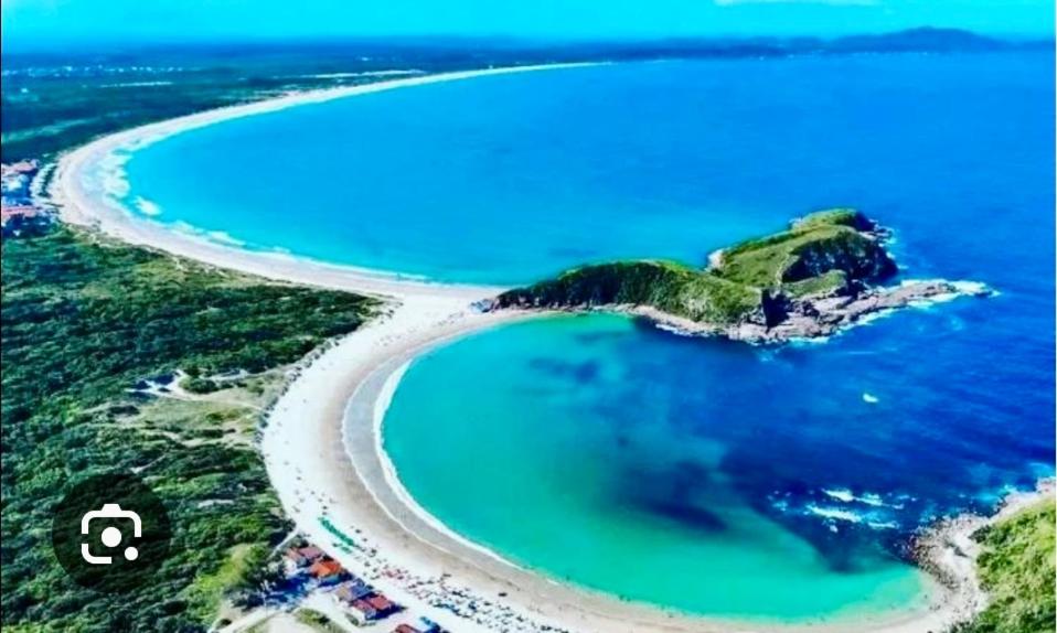 an aerial view of an island in the ocean at Suíte férias in Cabo Frio