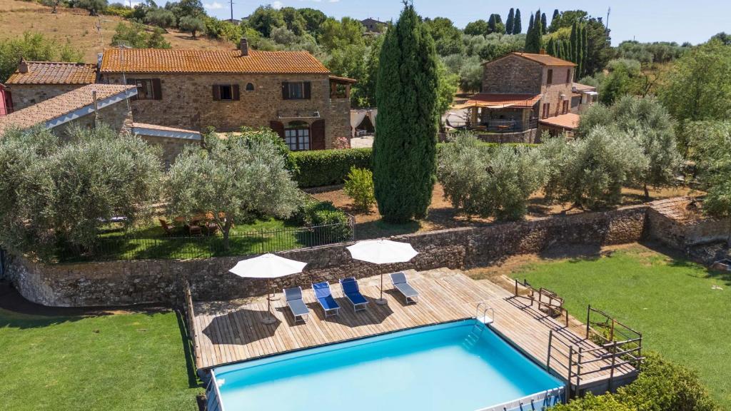 an external view of a villa with a swimming pool at La Fontaccia 13 by VacaVilla in Montiano