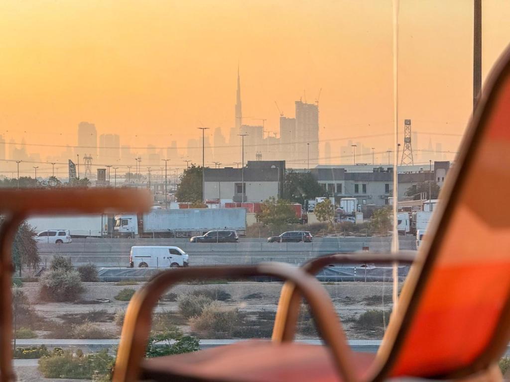 a view of a parking lot with a view of a city at GuestReady - Studio | City-View Getaway in Dubai