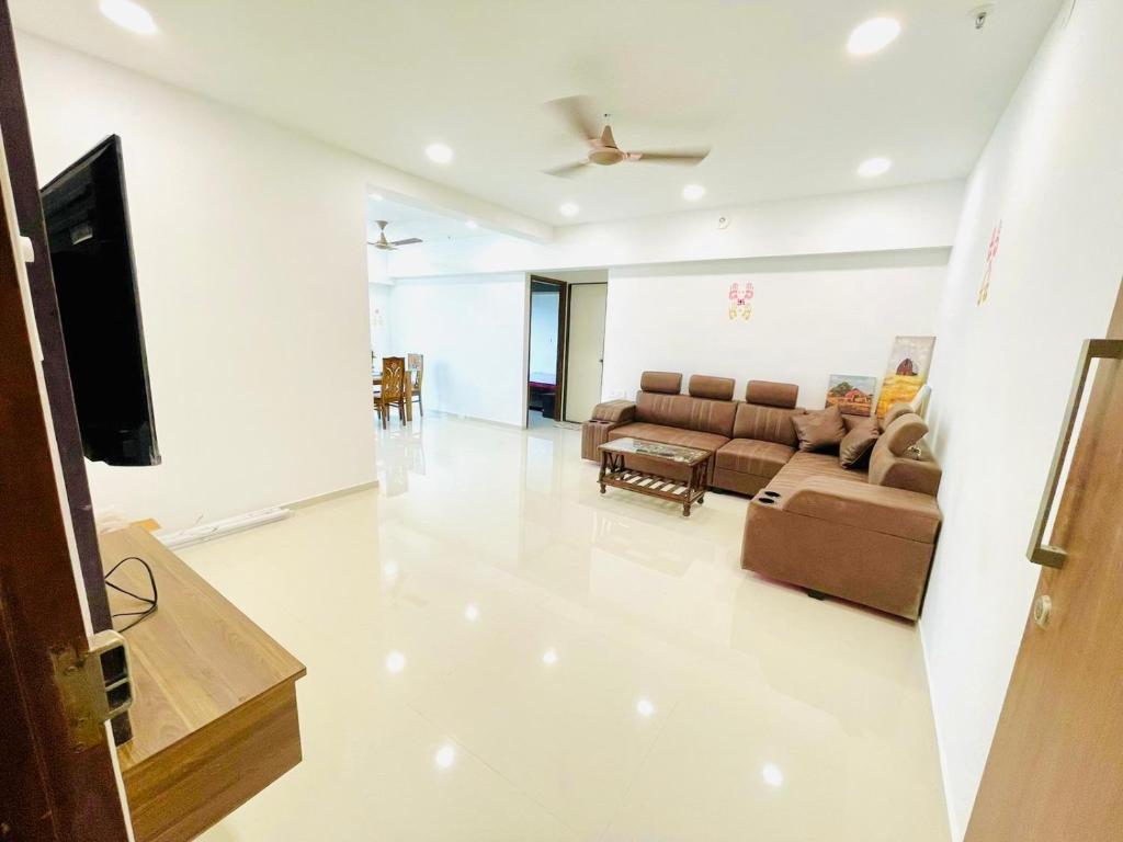 a living room with a couch and a flat screen tv at 2bhk in mumbai spacious in Mumbai