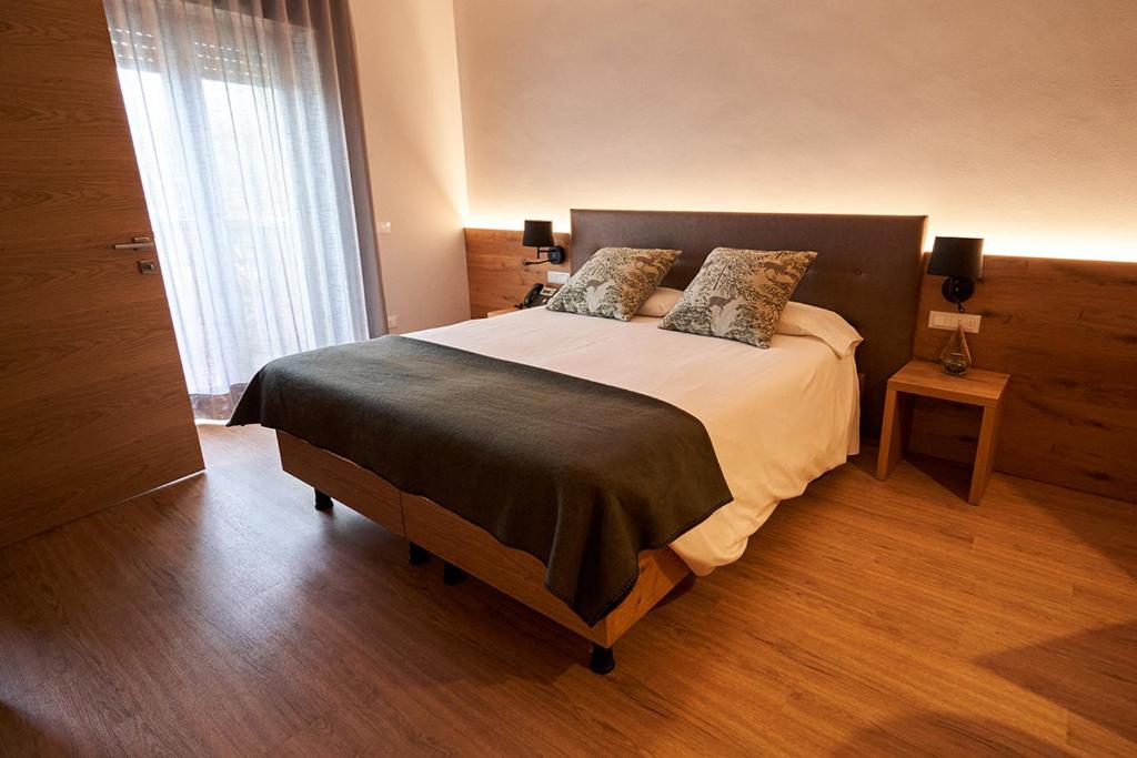 Ένα ή περισσότερα κρεβάτια σε δωμάτιο στο Hotel Ristorante Pennar