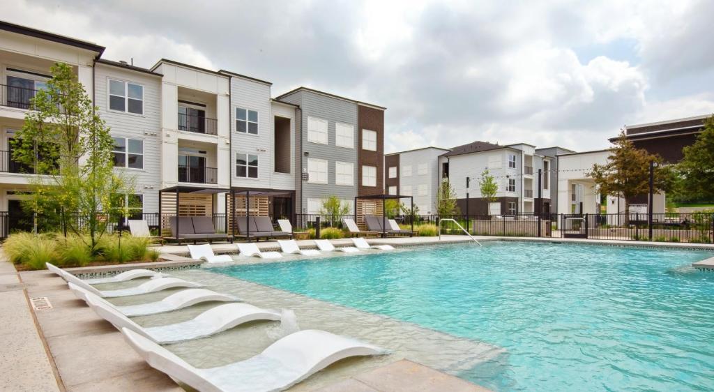 an image of a swimming pool at a apartment complex at Charming 2 bedroom in San Marcos in San Marcos