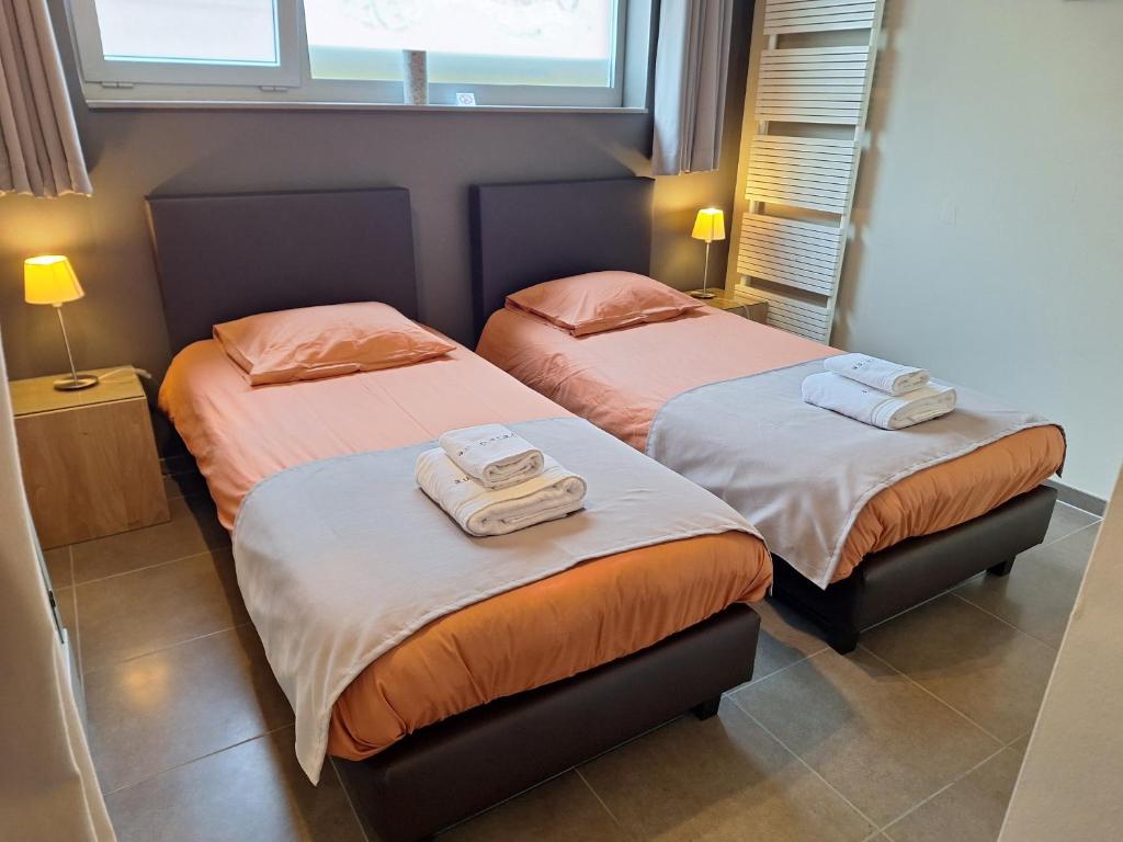 Ένα ή περισσότερα κρεβάτια σε δωμάτιο στο Au Paradis Guesthouse