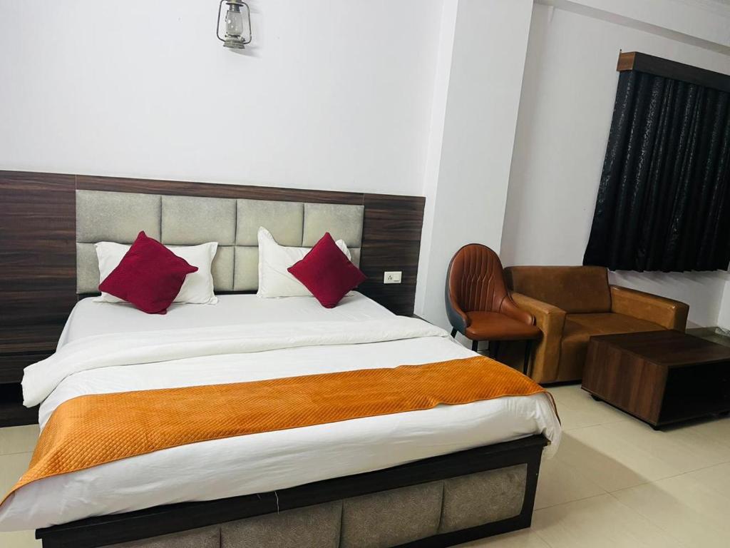 Voodi või voodid majutusasutuse Deluxeinn toas