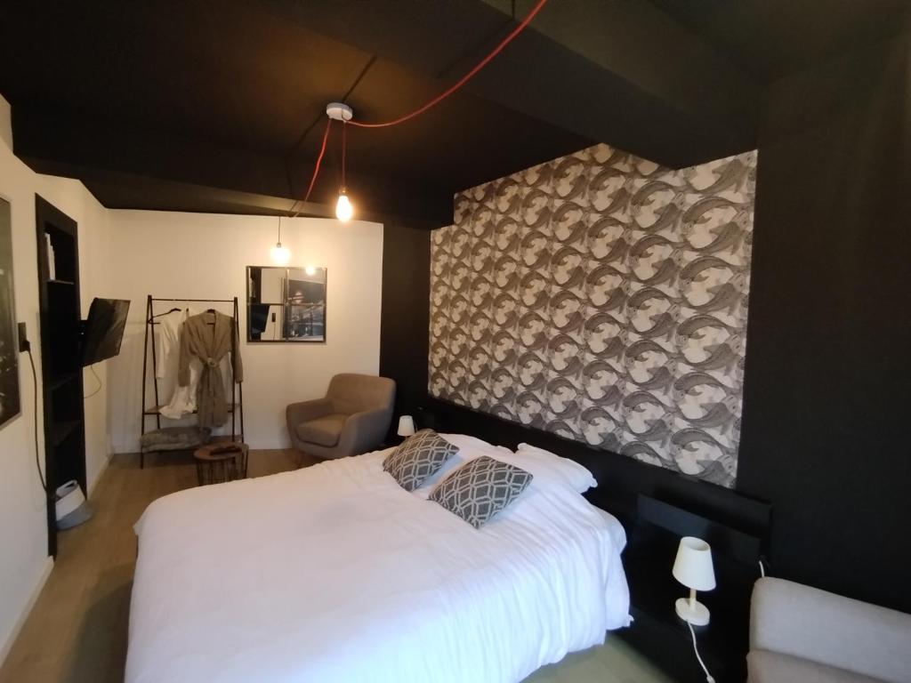 Ένα ή περισσότερα κρεβάτια σε δωμάτιο στο Barotel - Bed & Dinner