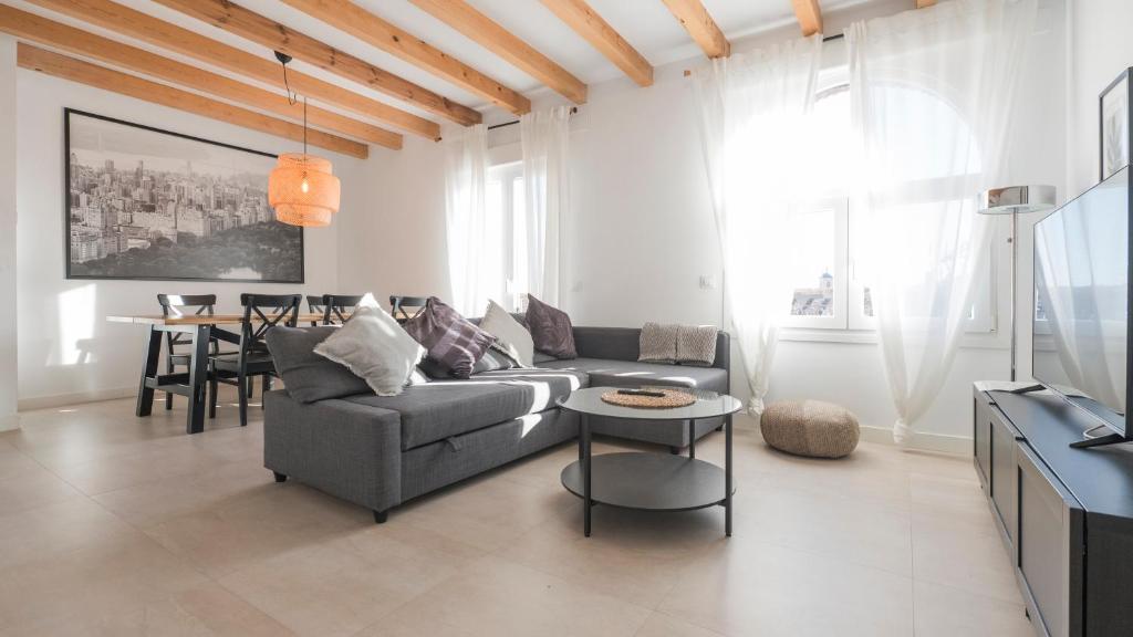 a living room with a couch and a table at San Torcuato VIII by Toledo AP in Toledo