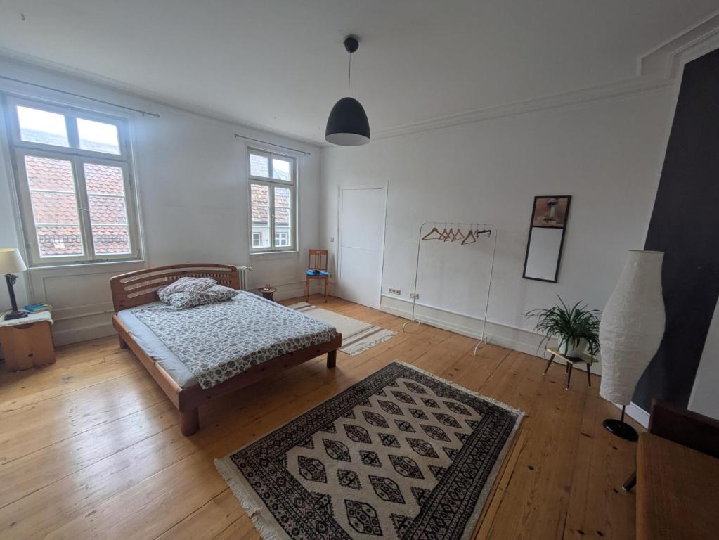 Postel nebo postele na pokoji v ubytování Einzelzimmer mit Altbau Charme