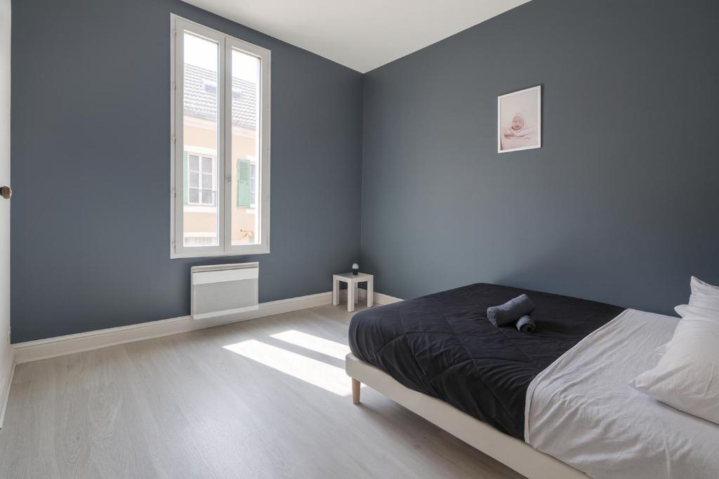 Postel nebo postele na pokoji v ubytování Maison Centre ville Meaux-Gare-Disney