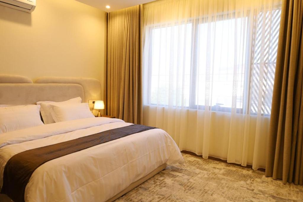 Кровать или кровати в номере شقق مفروشة هداج تاون العلا