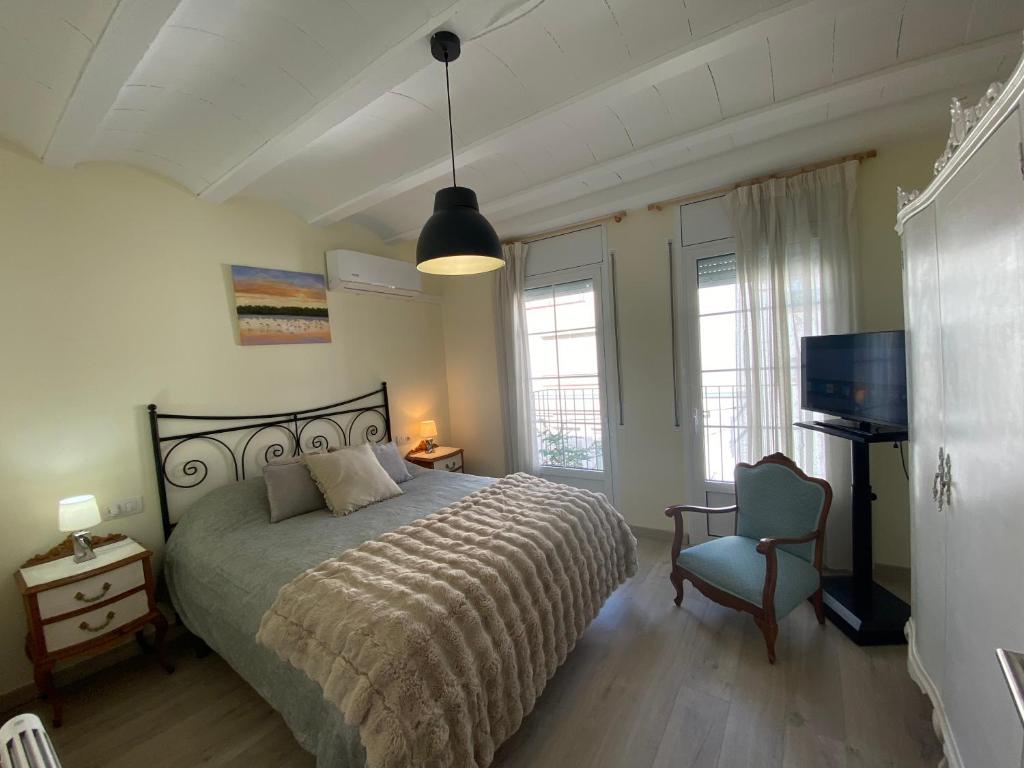 Ένα ή περισσότερα κρεβάτια σε δωμάτιο στο Los tres castells