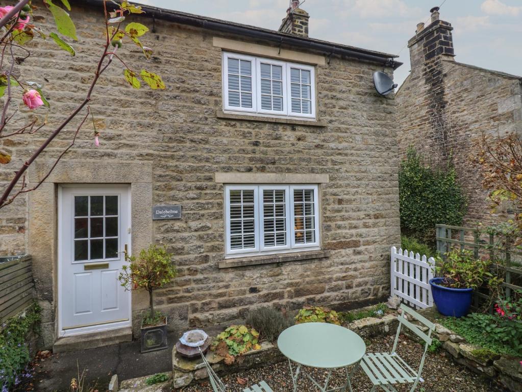 a brick house with a table in front of it at Daleholme in Barnard Castle