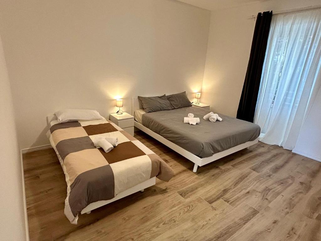 En eller flere senge i et værelse på New House - Garden park bbq