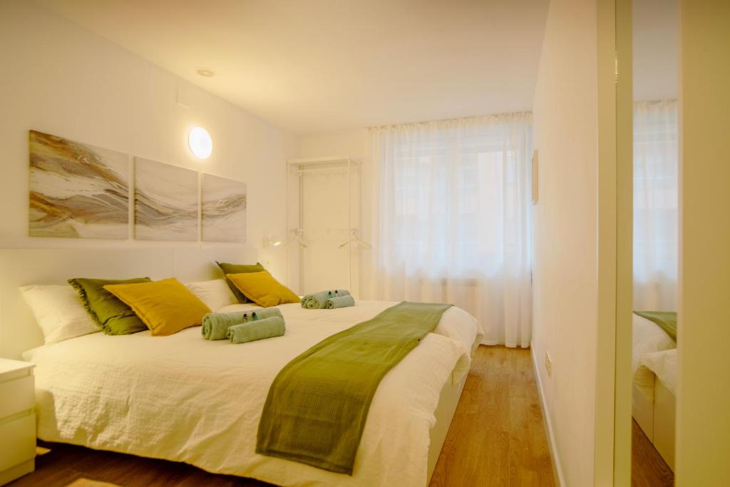 Ένα ή περισσότερα κρεβάτια σε δωμάτιο στο Habitaciones Algodón con baño propio