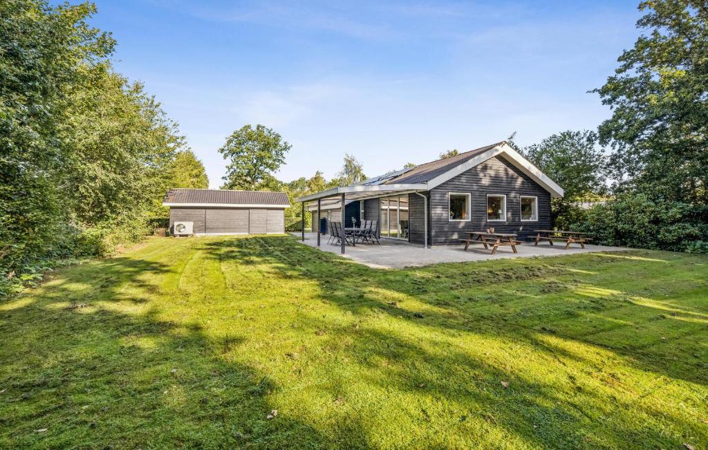 a large yard in front of a house at Gorgeous Home In Farsø With Wifi in Hole