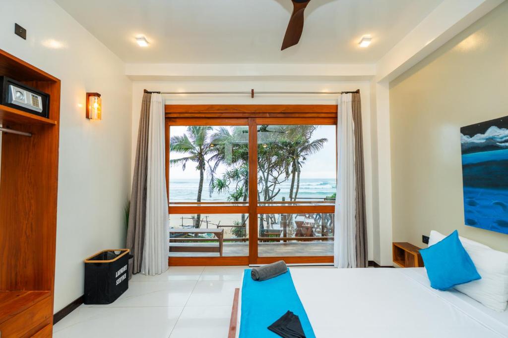 Ένα ή περισσότερα κρεβάτια σε δωμάτιο στο LIYA BEACH - Luxury Boutique Hotel in Ahangama