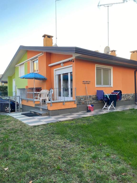 a house with a porch and a patio at Polluce in Bibione