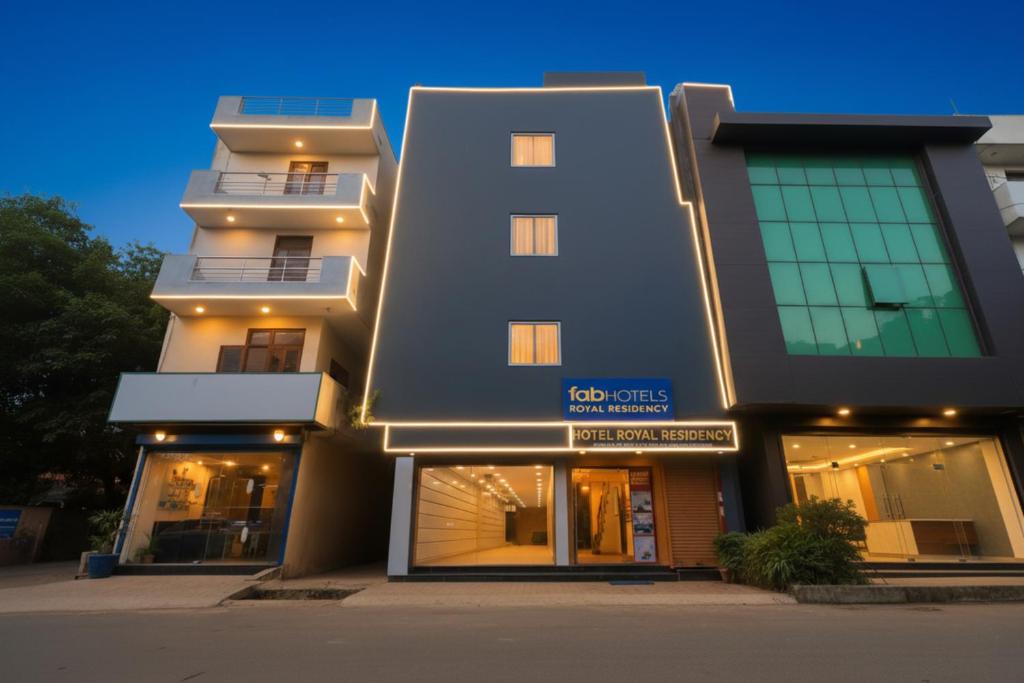 a large building with lights on the side of it at FabHotel Royal Reena Residency in New Delhi