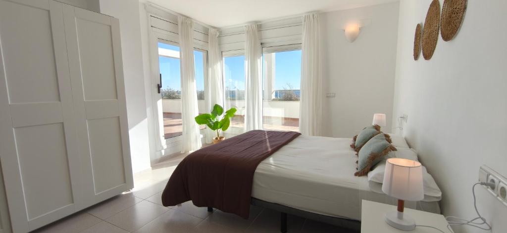 En eller flere senge i et værelse på Ático Ancla