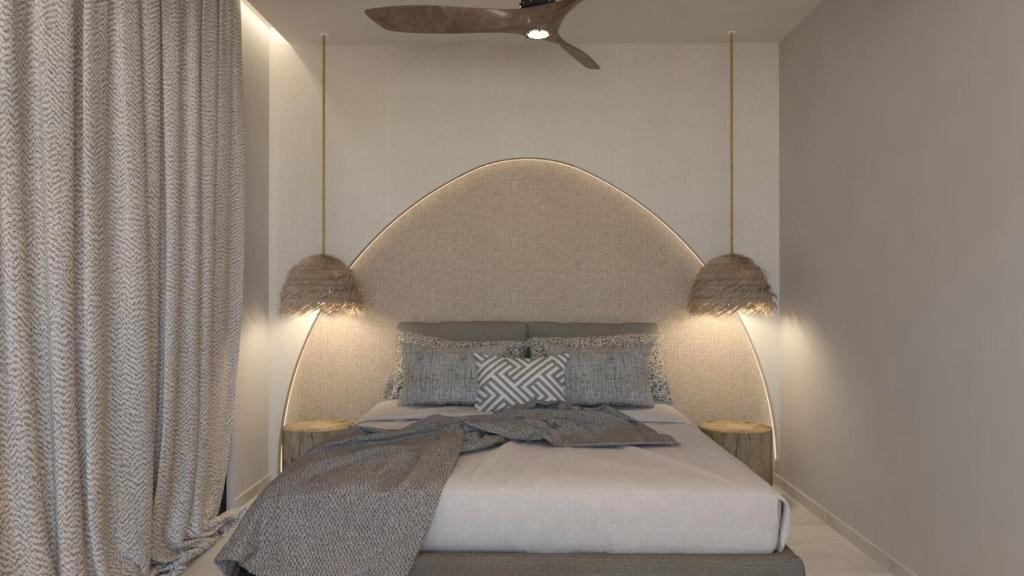 Postel nebo postele na pokoji v ubytování NAMA Suites