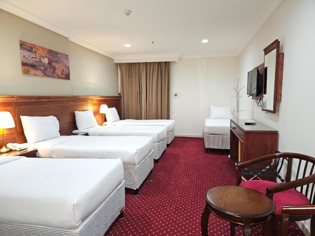 Ένα ή περισσότερα κρεβάτια σε δωμάτιο στο فندق وفاق صدقي