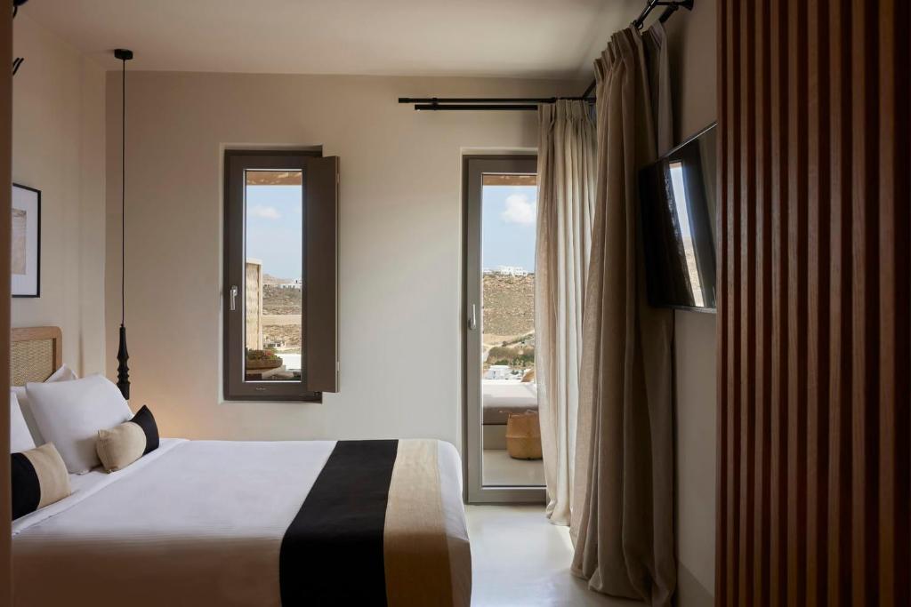 Postel nebo postele na pokoji v ubytování Hotiday Mykonos South Coast