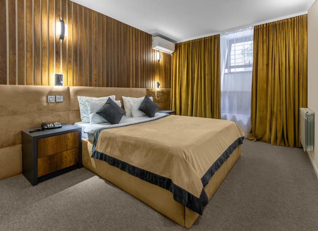 Ένα ή περισσότερα κρεβάτια σε δωμάτιο στο Onze Boutique Hotel Baku