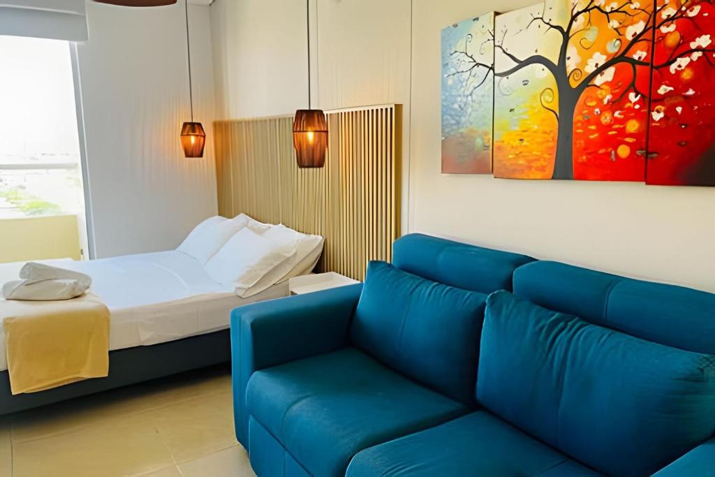 En eller flere senge i et værelse på Hermoso Loft Velas al mar