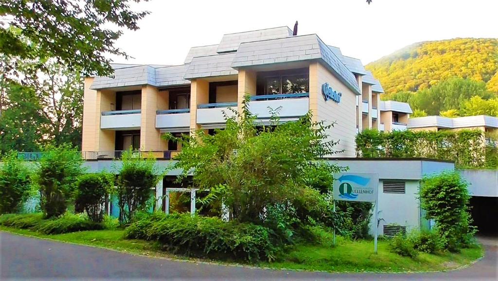 a building on the side of a road at Hotel Quellenhof - Self-Check-in in Bad Urach