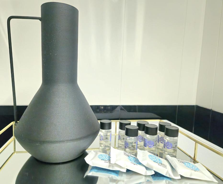 a vase sitting on top of a table with toothpaste at Mary's luxury apartment Nemea 2 in Neméa