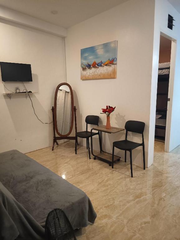 Μια τηλεόραση ή/και κέντρο ψυχαγωγίας στο 1 BR Lumina Homes - Your Home Away From Home