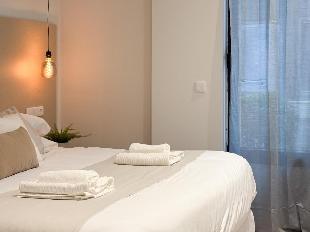 Ένα ή περισσότερα κρεβάτια σε δωμάτιο στο TAYP Navalmoral Apartamentos