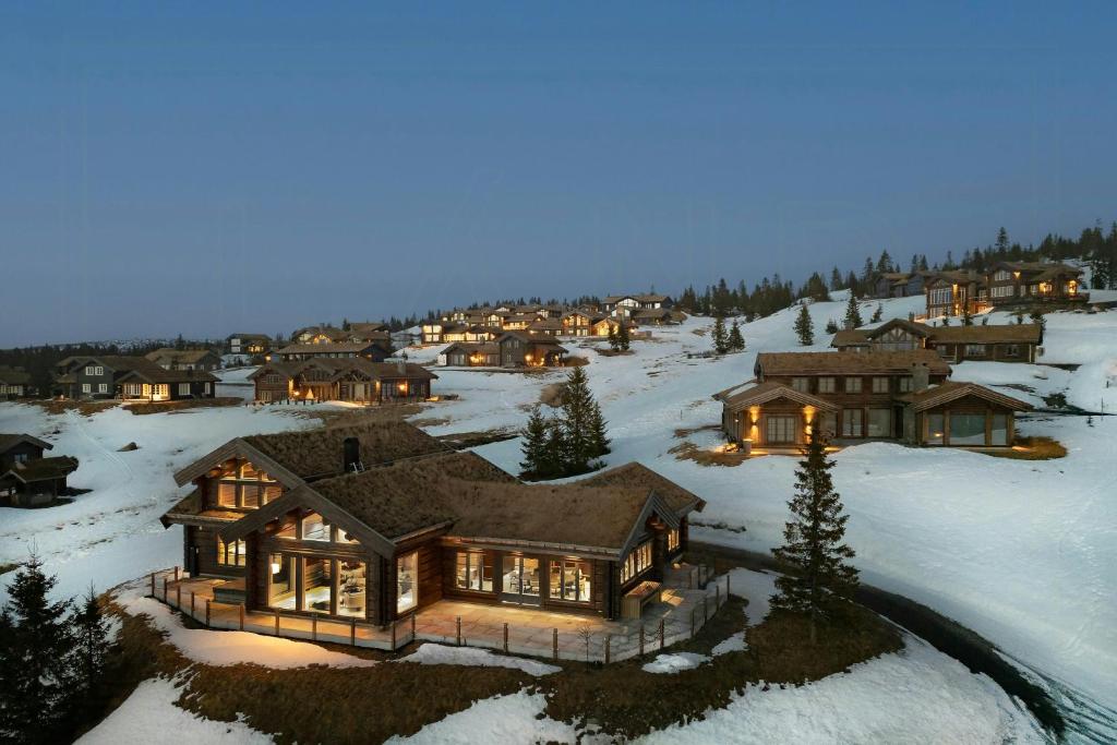 an aerial view of a house in the snow at Luxurious Log Cabin At Mostertoppen in Øyer
