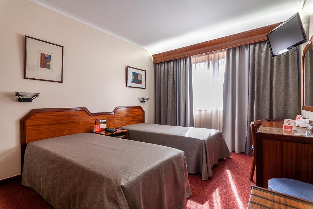 Ένα ή περισσότερα κρεβάτια σε δωμάτιο στο Hotel Nacional